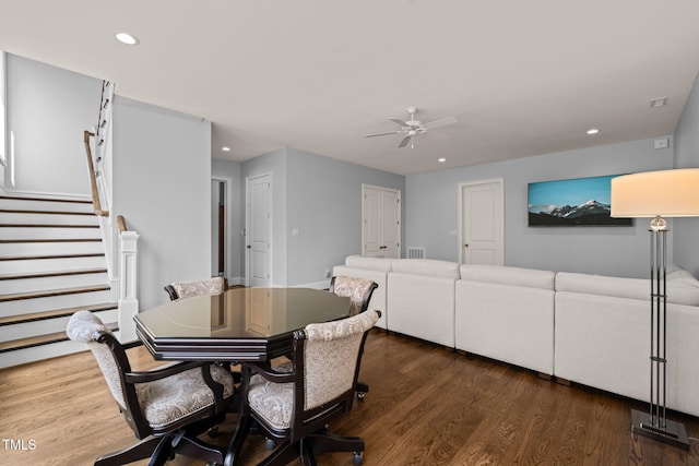 dining room featuring recessed lighting, wood finished floors, ceiling fan, and stairs