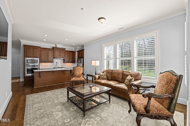 living room with visible vents, baseboards, recessed lighting, ornamental molding, and dark wood-type flooring