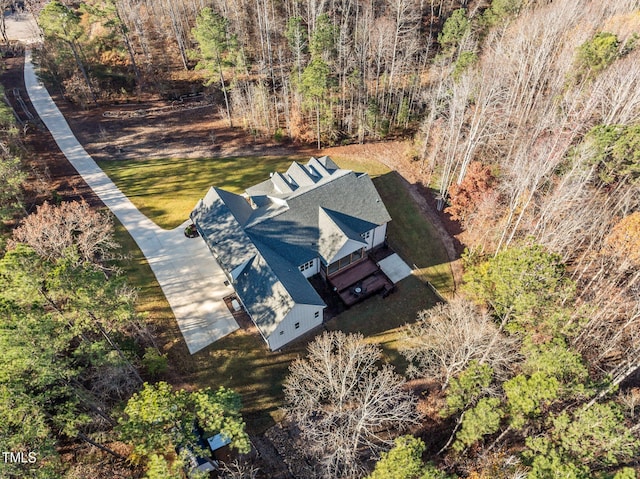 birds eye view of property with a forest view