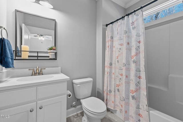 bathroom featuring baseboards, ceiling fan, toilet, shower / tub combo, and vanity