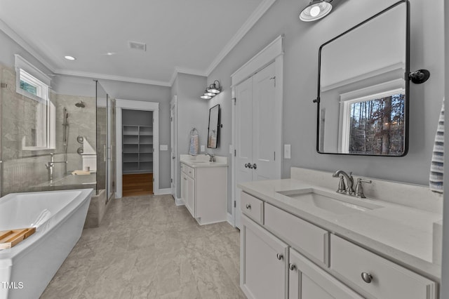 full bath featuring visible vents, a stall shower, crown molding, and a sink