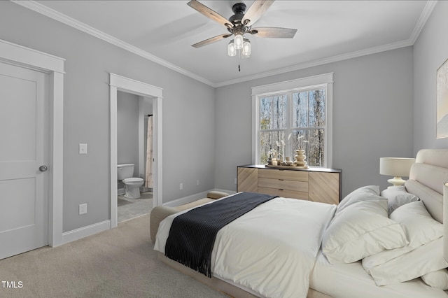 bedroom with ensuite bathroom, baseboards, carpet floors, and ornamental molding