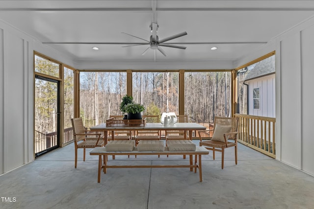 sunroom with a ceiling fan