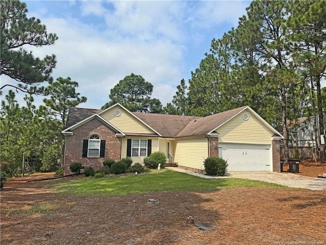 ranch-style house with a garage and a front yard