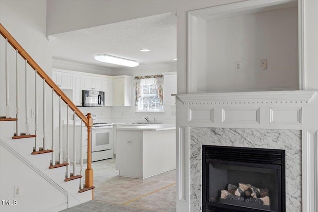 interior space featuring a textured ceiling and a premium fireplace