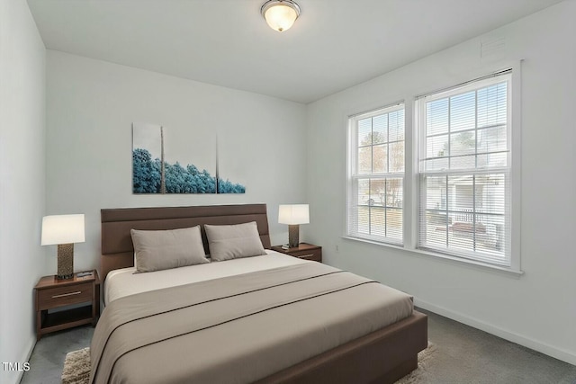 carpeted bedroom with baseboards