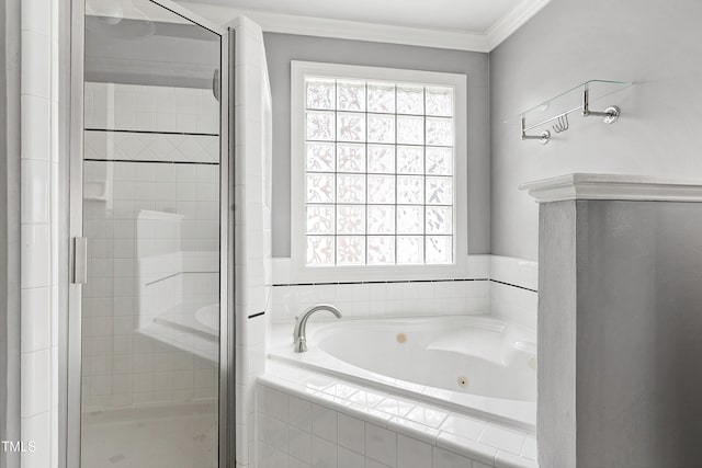 bathroom with a healthy amount of sunlight, a shower stall, a tub with jets, and crown molding