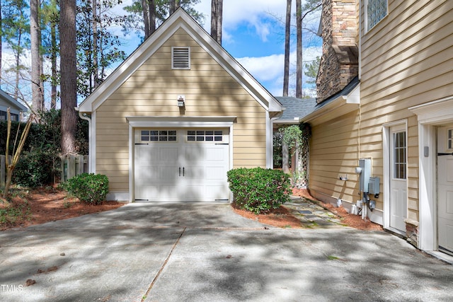 garage featuring driveway