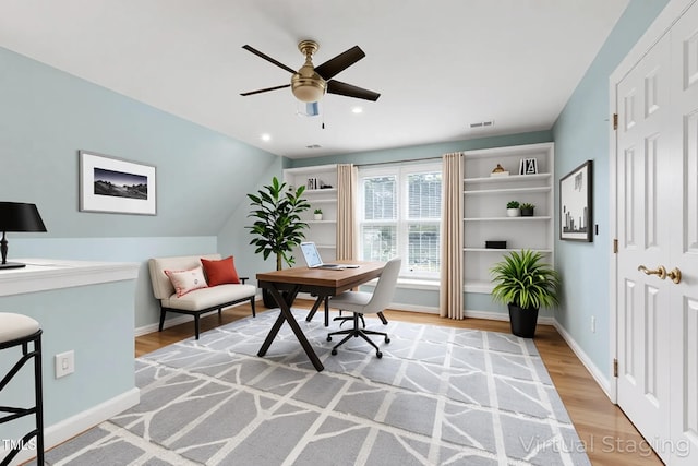 office area with a ceiling fan, baseboards, recessed lighting, light wood-type flooring, and visible vents