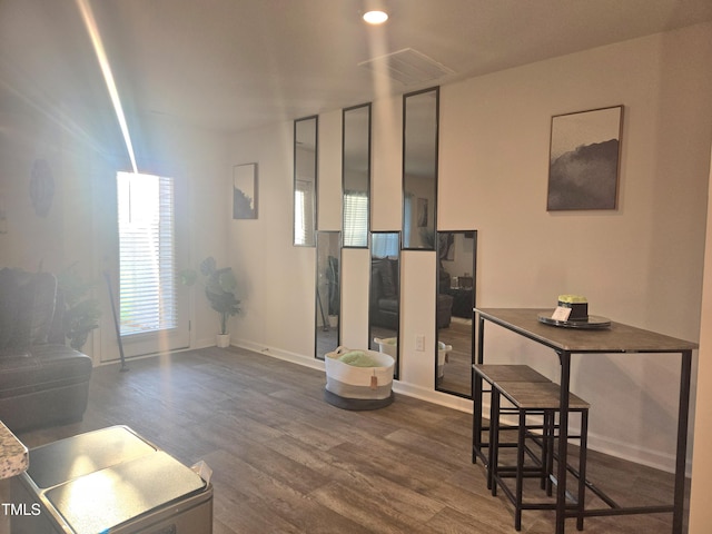 living room with dark wood-style flooring and baseboards