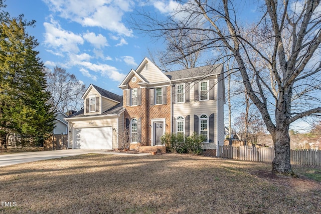 colonial house with crawl space, fence, a garage, concrete driveway, and brick siding