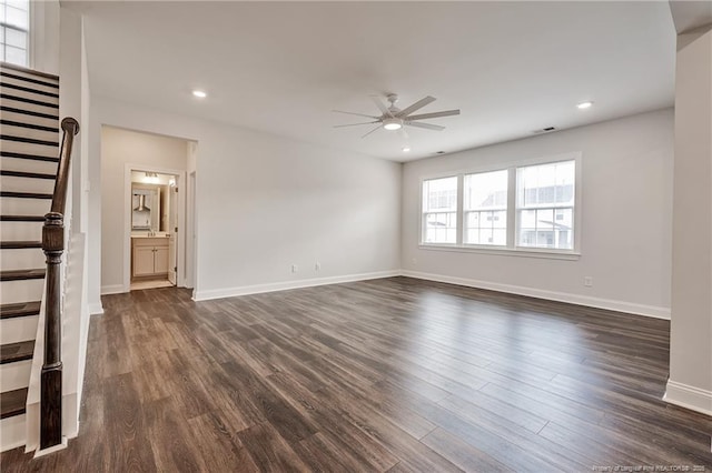 unfurnished living room with ceiling fan and dark hardwood / wood-style flooring