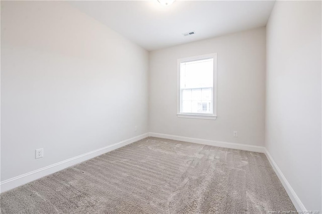 unfurnished room featuring carpet floors