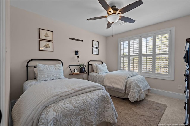 bedroom featuring ceiling fan and light colored carpet