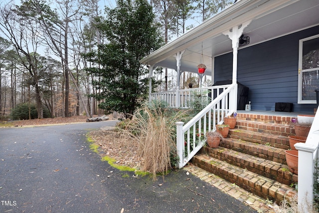 doorway to property with a porch