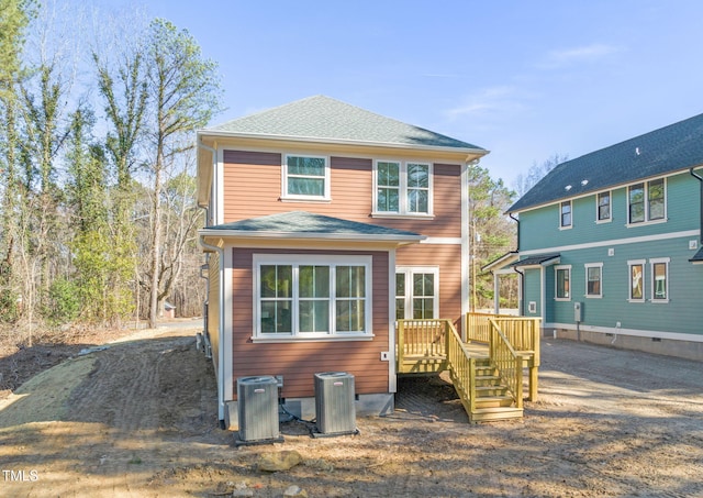 back of property with a deck and central air condition unit