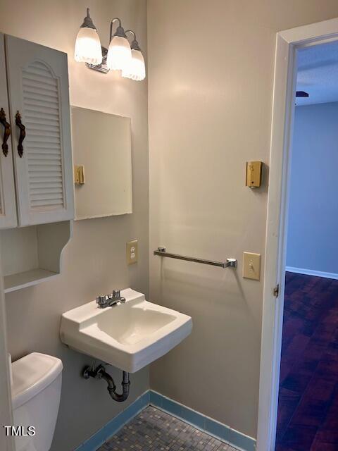 bathroom with sink and toilet