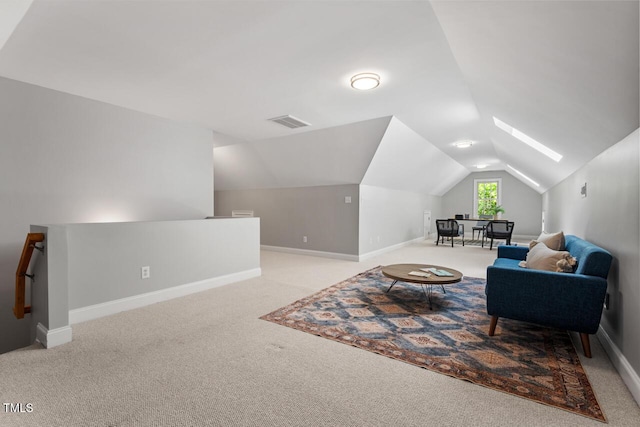 living area with carpet, baseboards, an upstairs landing, vaulted ceiling, and visible vents