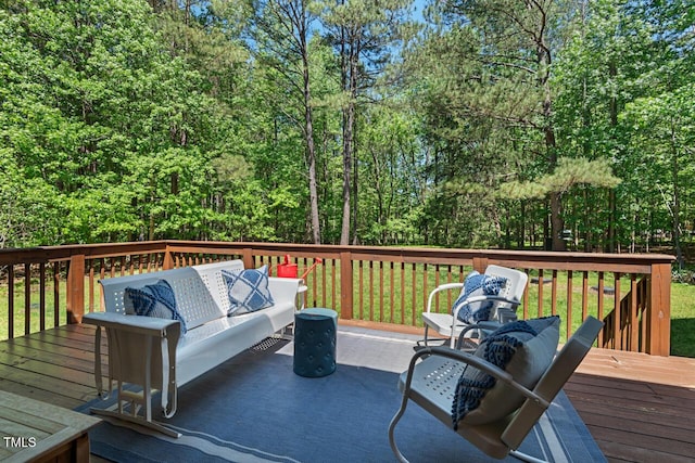 wooden deck with an outdoor living space