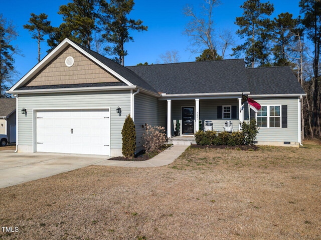 ranch-style house featuring a garage, covered porch, and a front yard