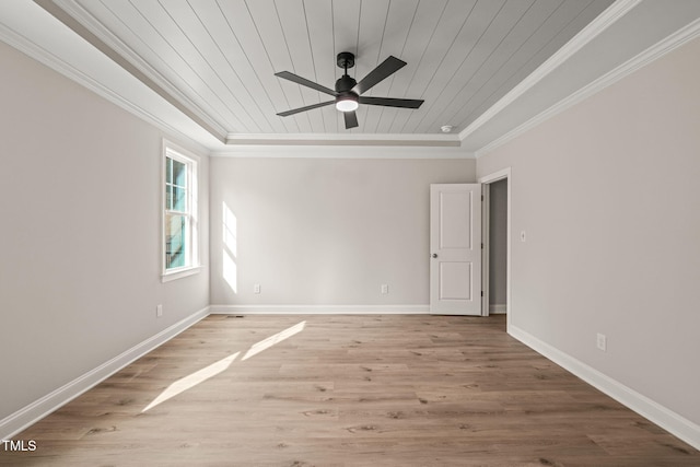unfurnished room with baseboards, wood ceiling, ornamental molding, and wood finished floors