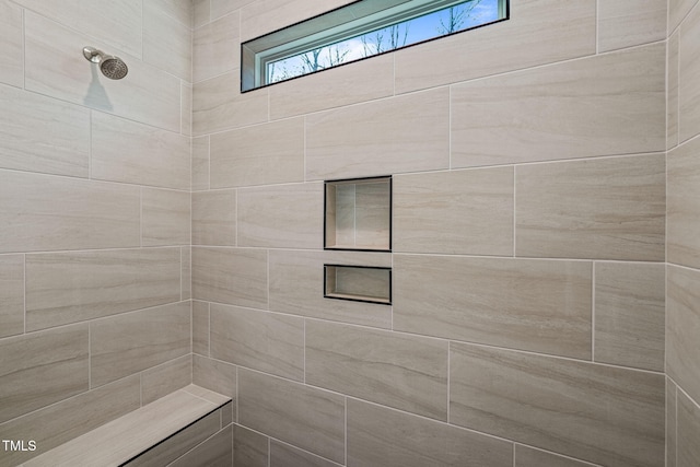 full bath with tiled shower