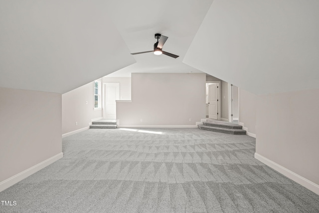 additional living space with carpet flooring and baseboards