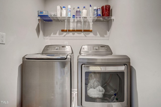 laundry area featuring laundry area and washing machine and clothes dryer