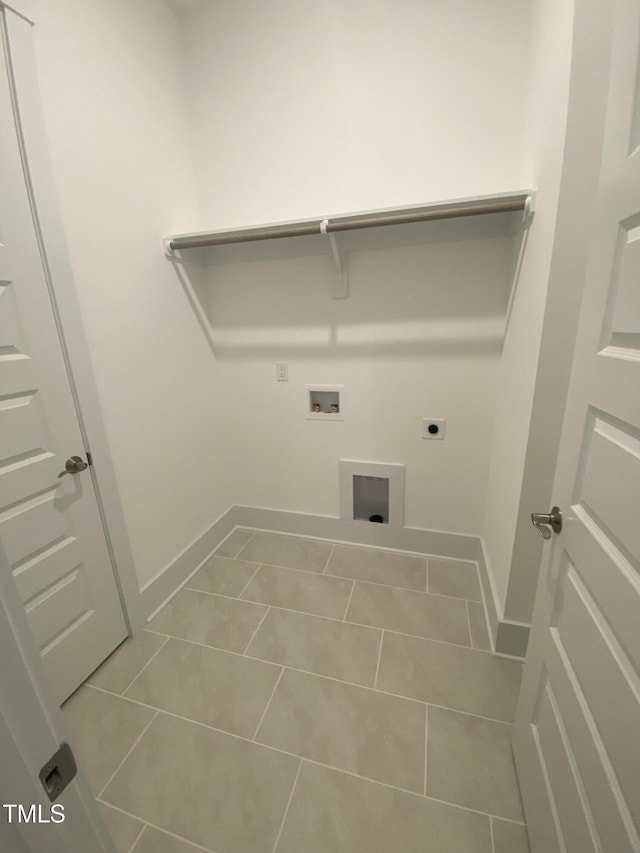 laundry area featuring laundry area, baseboards, hookup for a washing machine, tile patterned floors, and hookup for an electric dryer