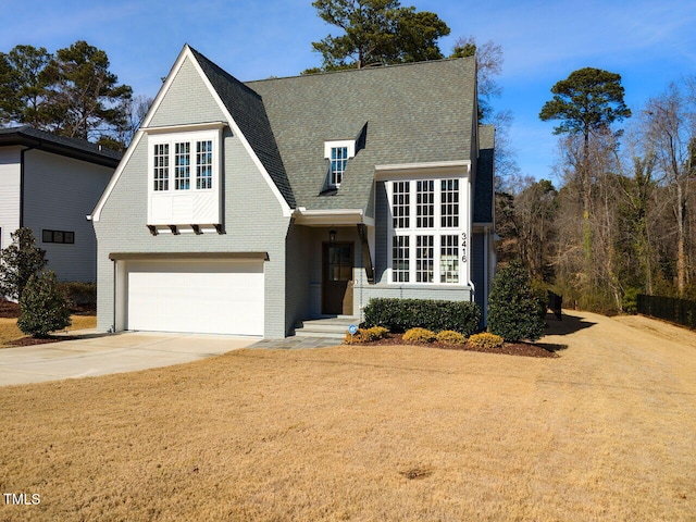 view of front facade with a front lawn and a garage