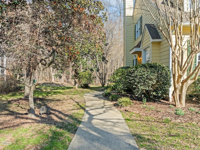 view of property exterior with a chimney