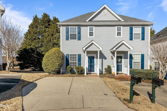 colonial home with a shingled roof