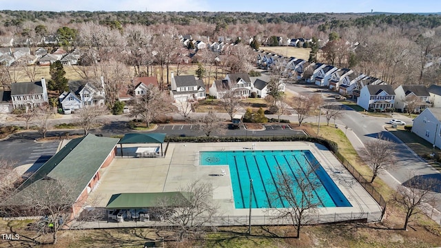 view of swimming pool featuring a residential view