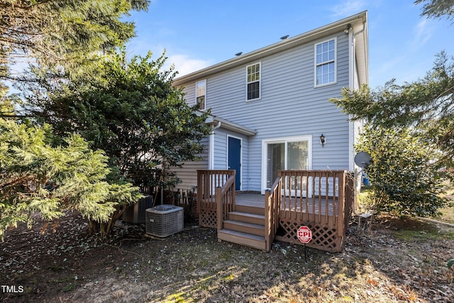 rear view of house featuring a deck and central air condition unit