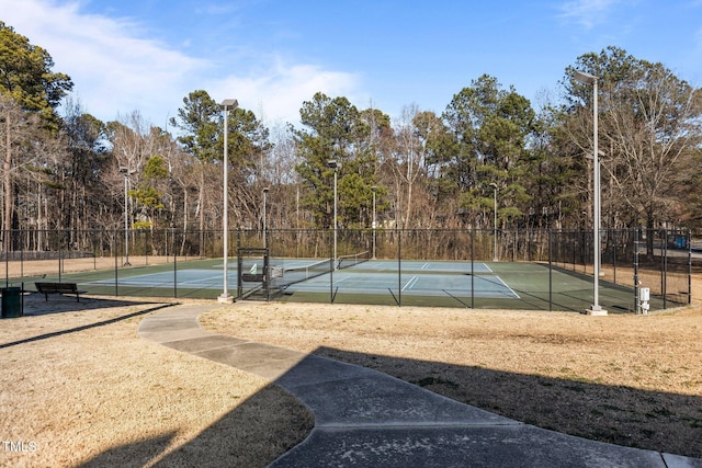 view of tennis court with fence