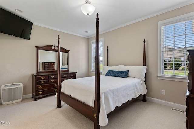 bedroom featuring crown molding and light colored carpet