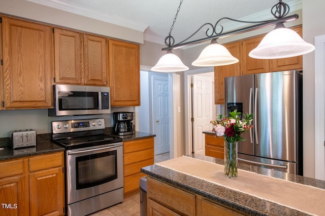 kitchen with stainless steel appliances, brown cabinets, decorative light fixtures, and ornamental molding