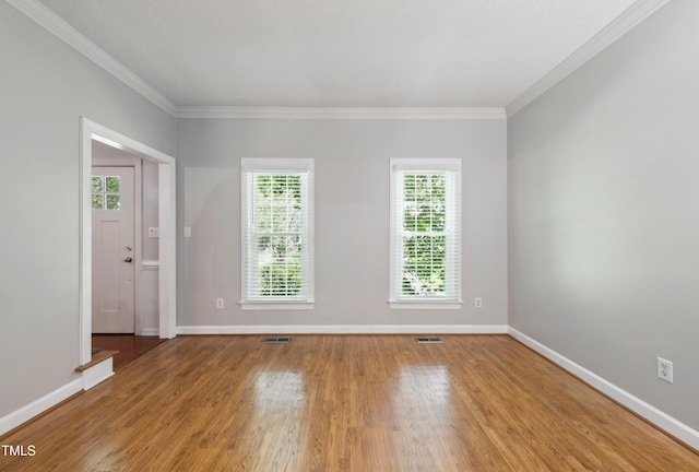 2006 Chedington Dr, Apex, NC 27502 - empty room featuring wood finished floors and crown molding