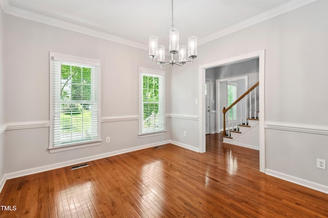 2006 Chedington Dr, Apex, NC 27502 - unfurnished room with a chandelier, hardwood / wood-style floors, ornamental molding, and stairs