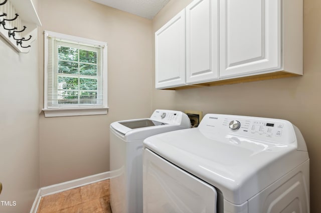 2006 Chedington Dr, Apex, NC 27502 - washroom featuring separate washer and dryer and cabinet space