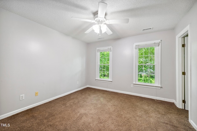 2006 Chedington Dr, Apex, NC 27502 - spare room with dark colored carpet, a textured ceiling, and ceiling fan
