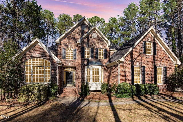 view of front of house with brick siding