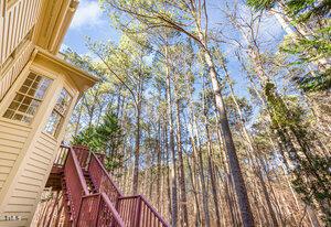 view of side of property featuring stairs