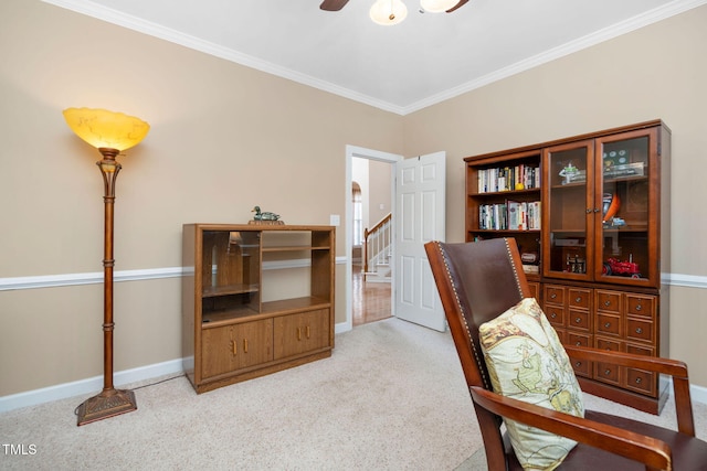 office space featuring carpet, ornamental molding, ceiling fan, and baseboards