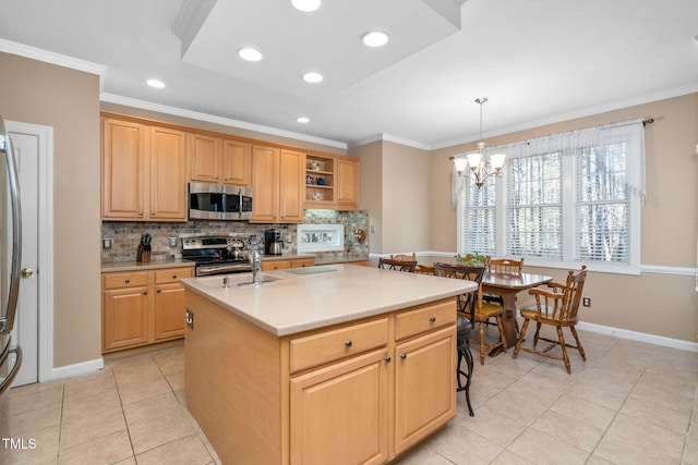 kitchen featuring stainless steel appliances, light countertops, ornamental molding, and tasteful backsplash