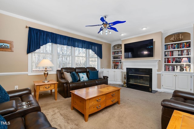 living room with a fireplace with flush hearth, ceiling fan, carpet floors, and ornamental molding