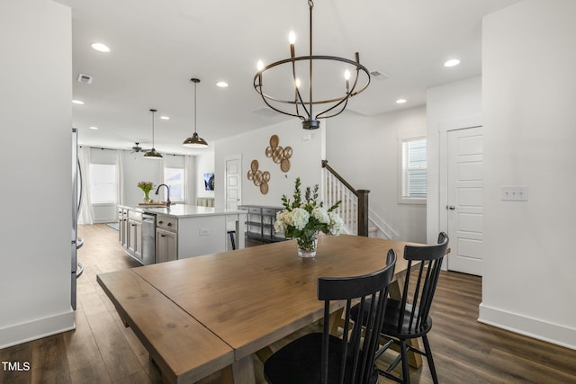 dining room with visible vents, baseboards, dark wood-type flooring, a notable chandelier, and recessed lighting