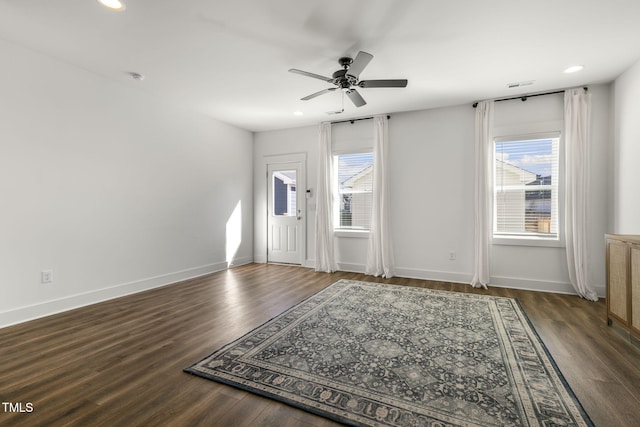 entrance foyer with baseboards, wood finished floors, and recessed lighting