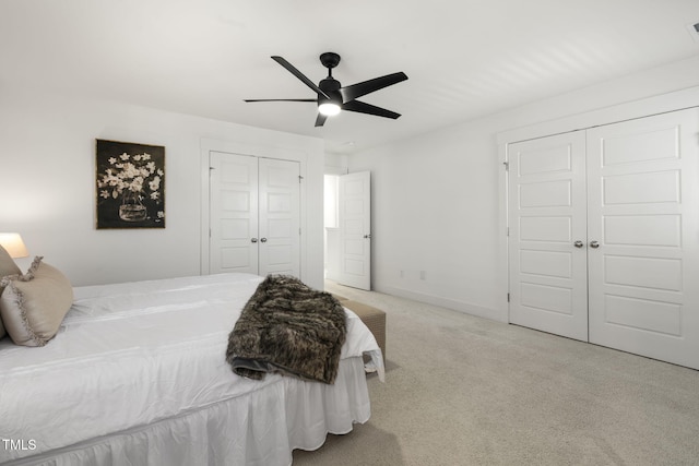 carpeted bedroom featuring ceiling fan and baseboards