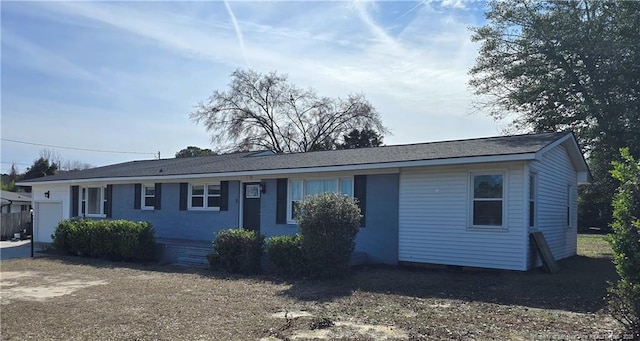 single story home featuring a garage